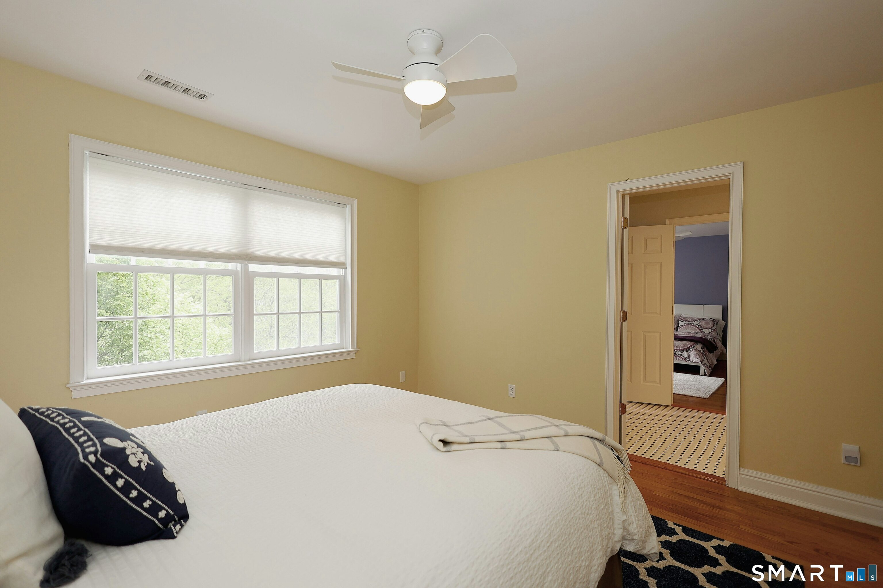30 Whipstick Road Ridgefield, CT 06877 - Photo 31 of 40 a bedroom with a bed and a window