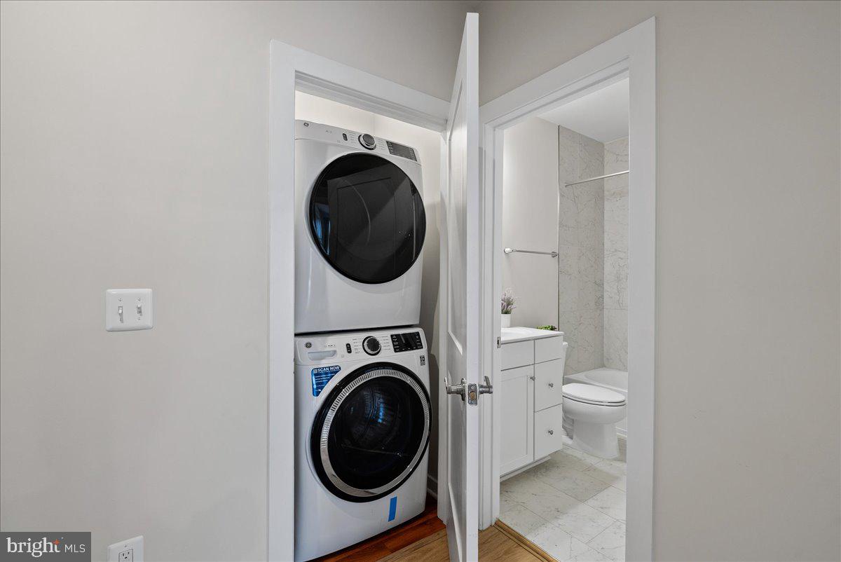 4128 Legato Road, Unit 53 Fairfax, VA 22033 - Photo 13 of 39 a view of a hallway with washer and dryer