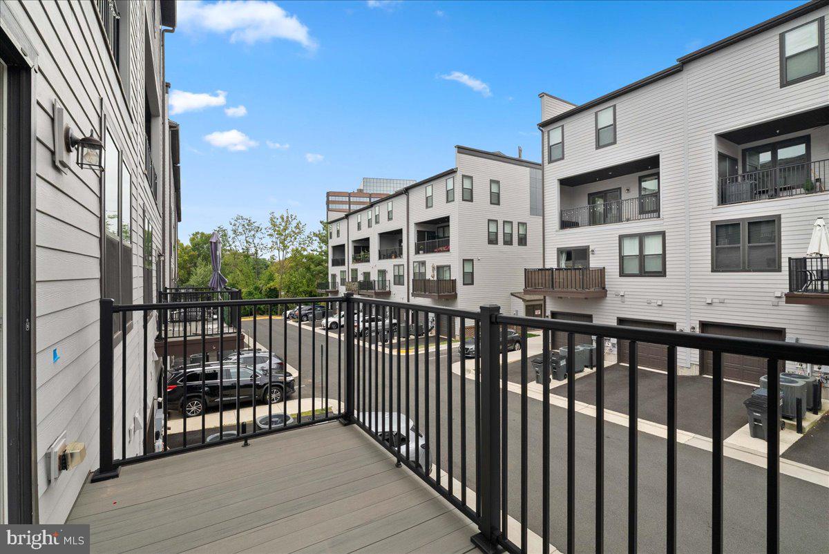 4128 Legato Road, Unit 53 Fairfax, VA 22033 - Photo 25 of 39 a view of a brick building from a balcony