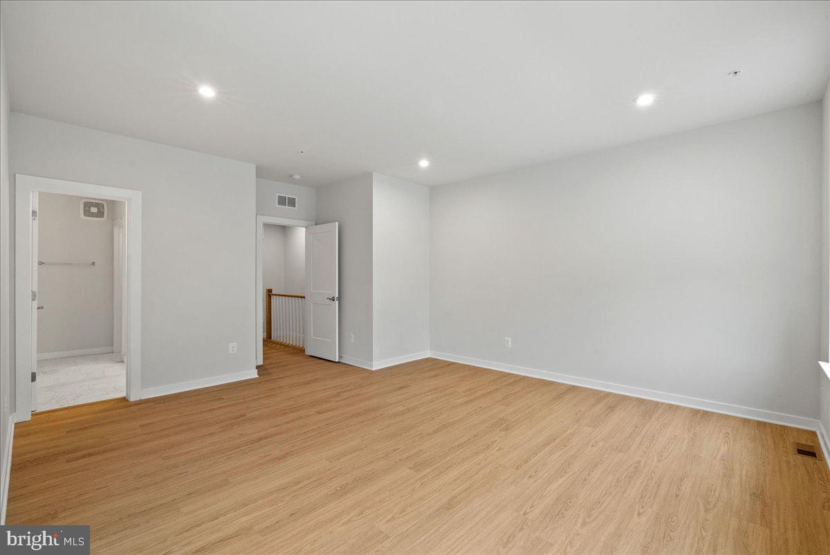 4128 Legato Road, Unit 53 Fairfax, VA 22033 - Photo 28 of 39 a view of empty room with wooden floor