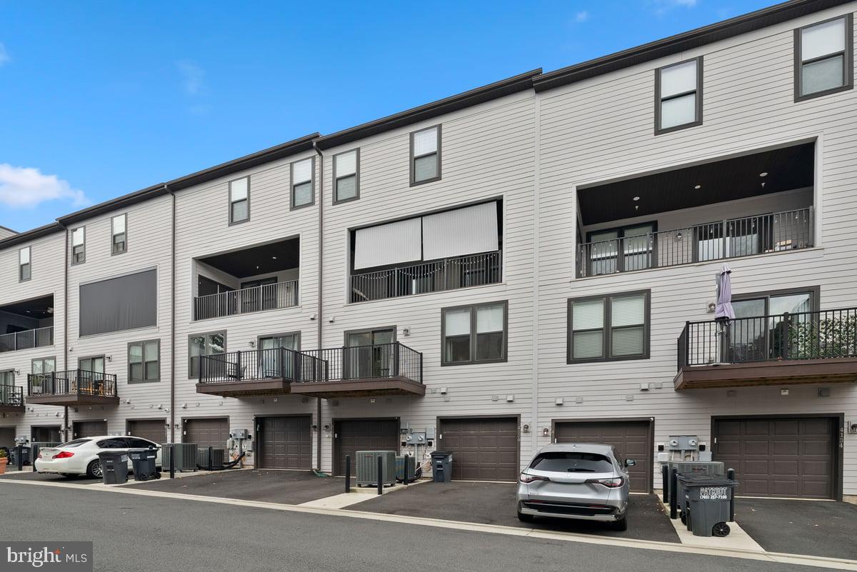 4128 Legato Road, Unit 53 Fairfax, VA 22033 - Photo 34 of 39 a car parked in front of a building