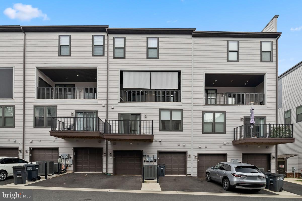 4128 Legato Road, Unit 53 Fairfax, VA 22033 - Photo 35 of 39 a car parked in front of building