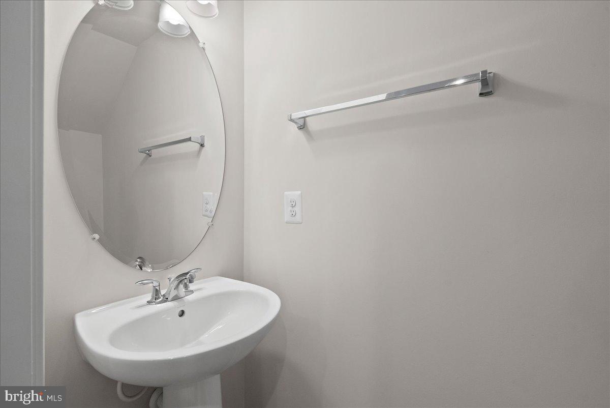 4128 Legato Road, Unit 53 Fairfax, VA 22033 - Photo 10 of 39 a bathroom with a sink and mirror