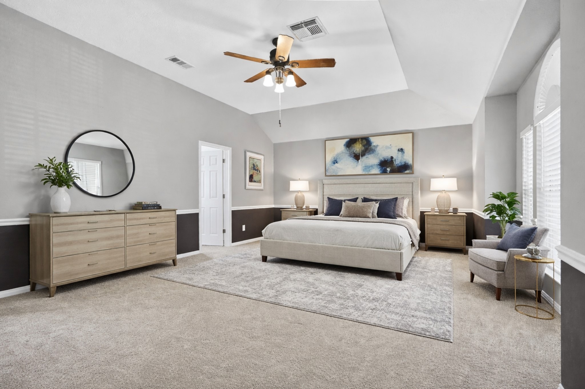 7622 McCormick Mill Court Houston, TX 77095 - Photo 28 of 40 a bedroom with a bed a potted plant on dresser and a chandelier