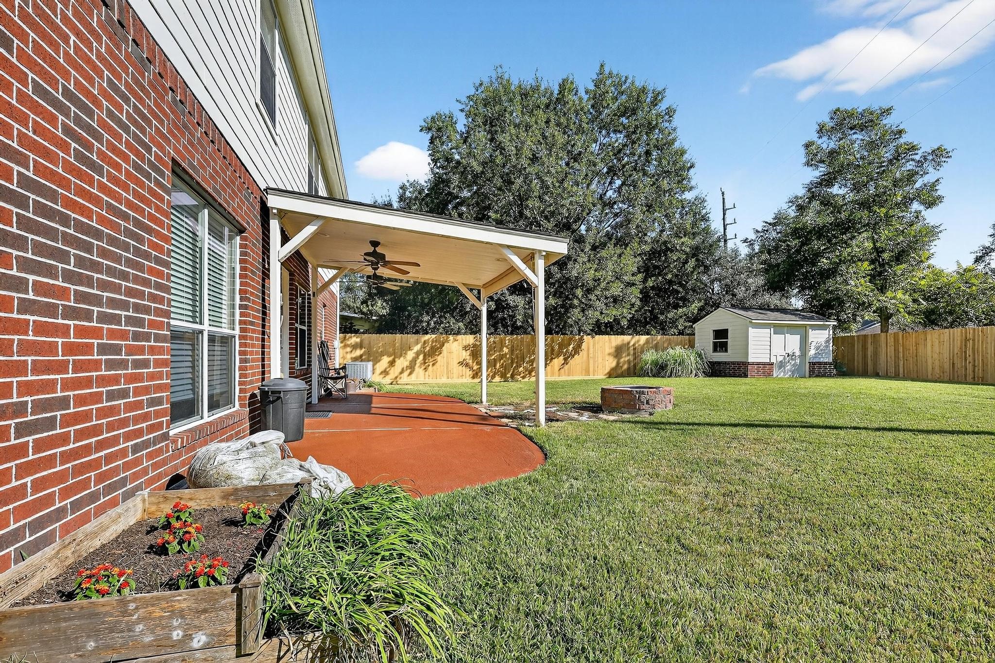 7622 McCormick Mill Court Houston, TX 77095 - Photo 6 of 40 a view of a house with a backyard porch and sitting area
