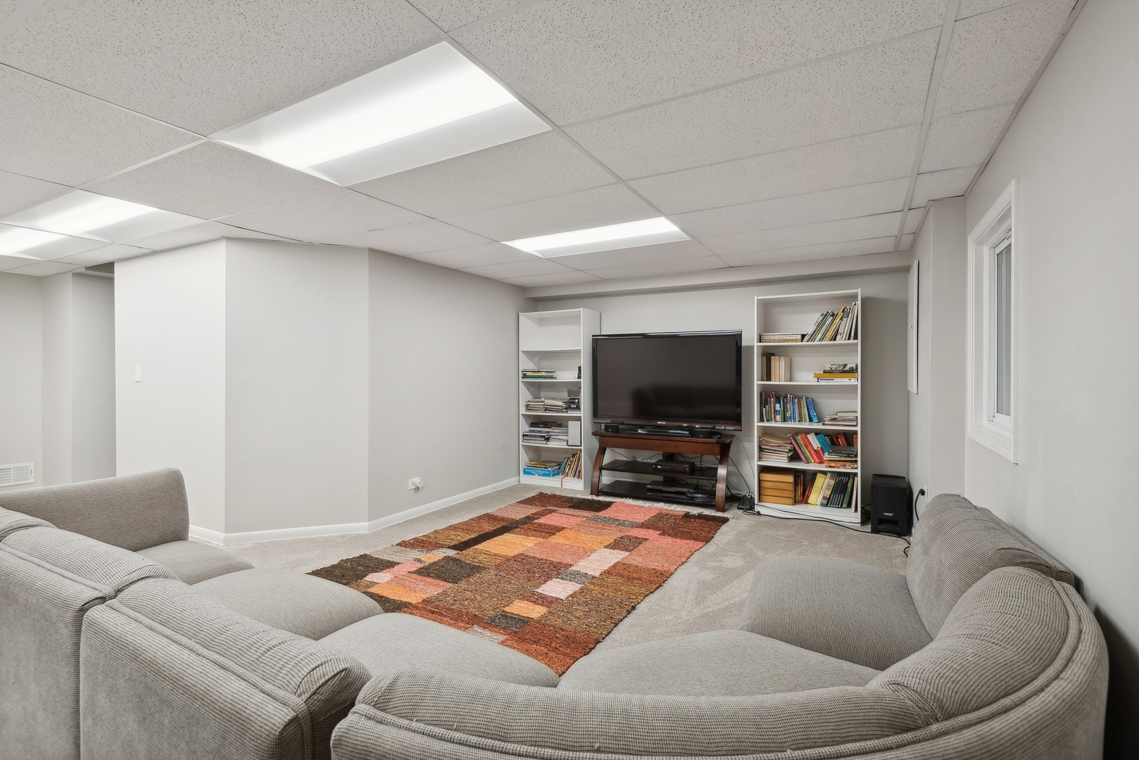 816 Echo Lane Glenview, IL 60025 - Photo 17 of 25 a living room with furniture and a flat screen tv