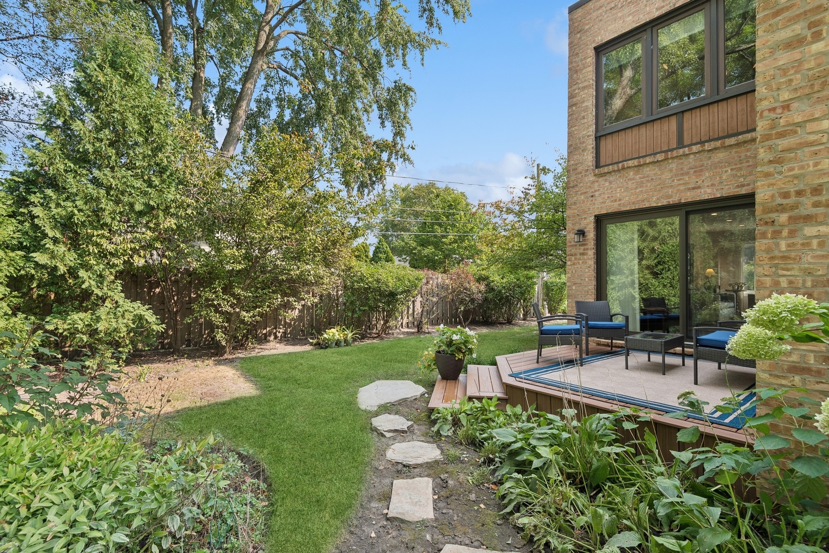 816 Echo Lane Glenview, IL 60025 - Photo 20 of 25 a view of a chair and table in backyard of the house