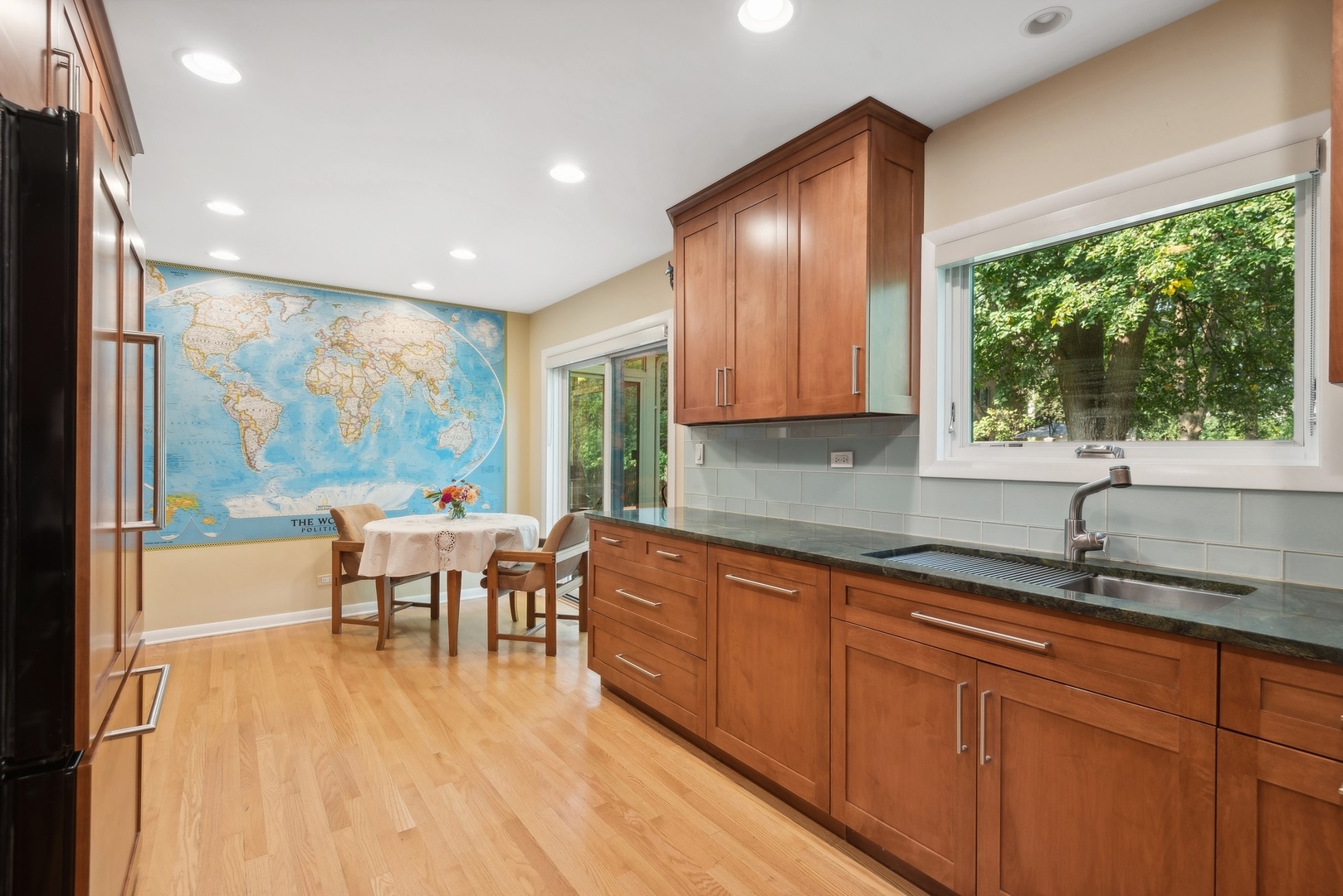 816 Echo Lane Glenview, IL 60025 - Photo 5 of 25 a kitchen with stainless steel appliances granite countertop sink stove and wooden cabinets