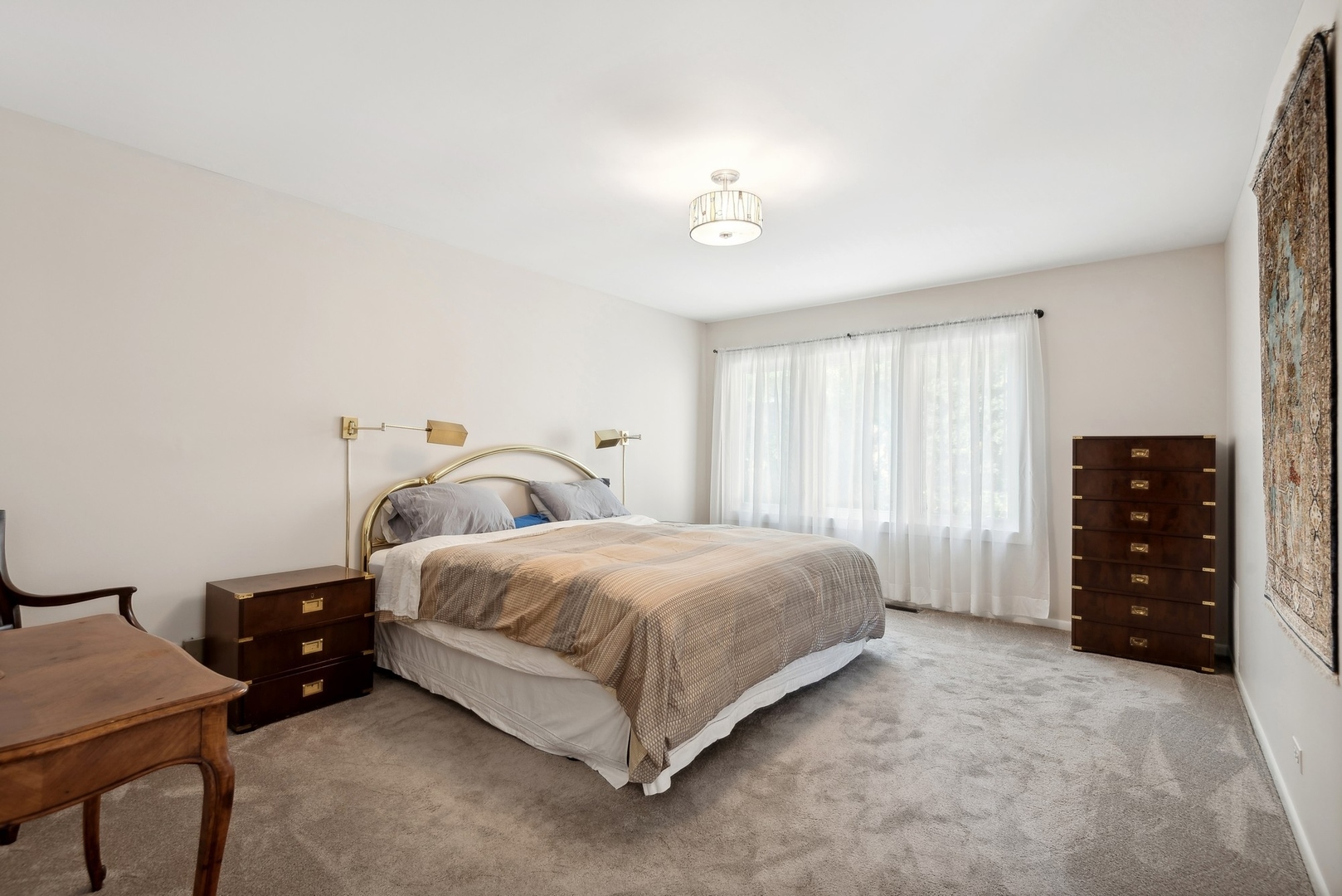 816 Echo Lane Glenview, IL 60025 - Photo 10 of 25 a spacious bedroom with a bed and a dresser