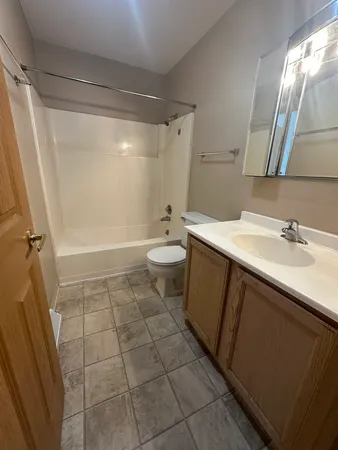 a bathroom with a sink a toilet and a shower