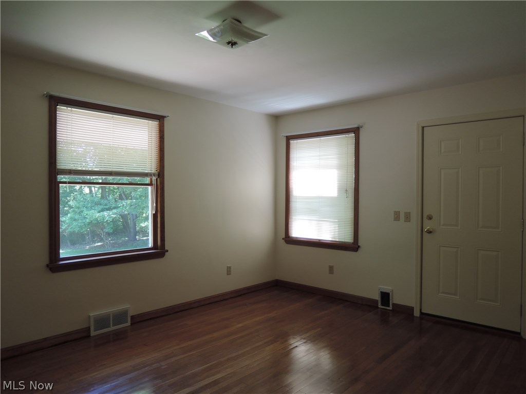 12853 Heath Road Chesterland, OH 44026 - Photo 14 of 28 First floor bedroom with door to the enclosed porch.