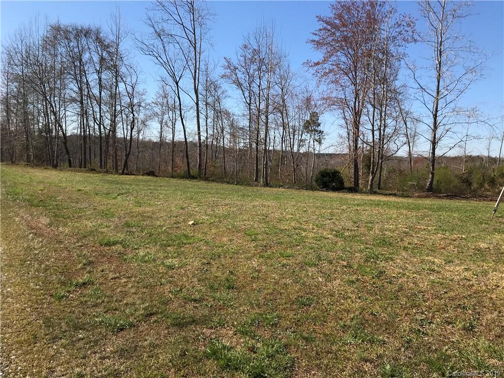 0 Troutman Farm Road Statesville, NC 28677 - Photo 1 of 6 a view of a yard with wooden fence