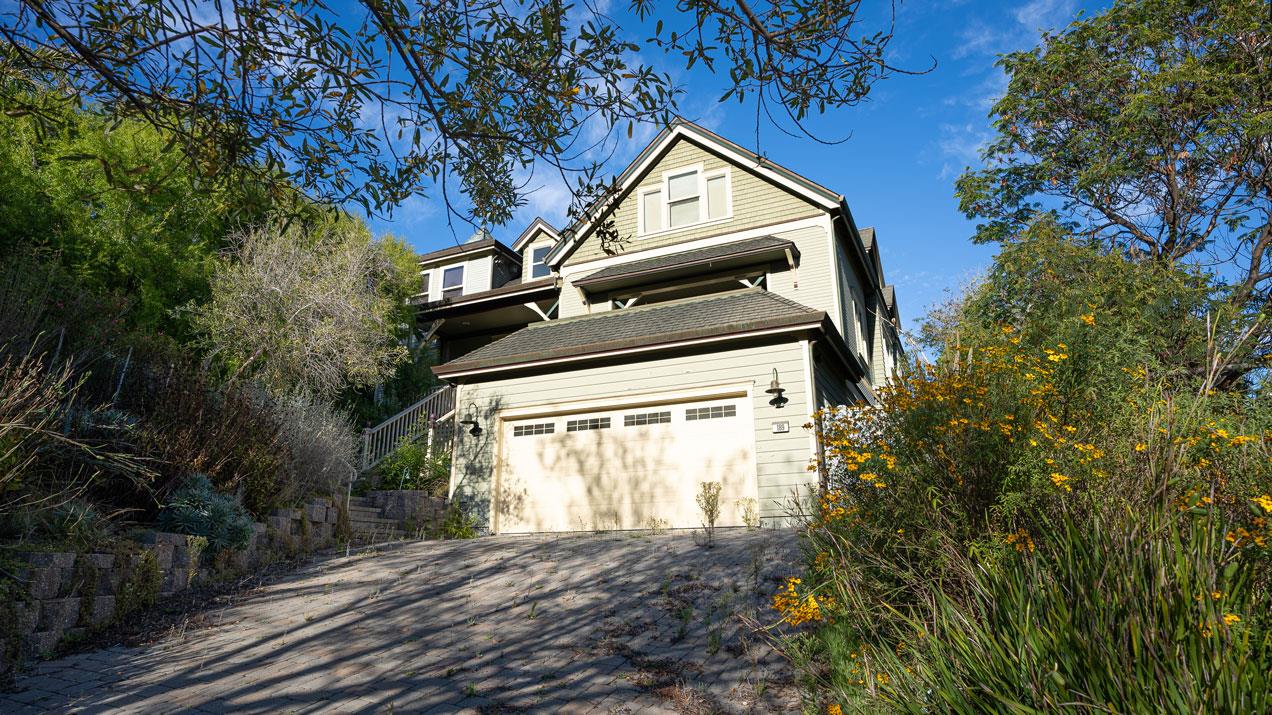 189 Kent Road Pacifica, CA 94044 - Photo 3 of 15 a view of a house with a small yard and large trees
