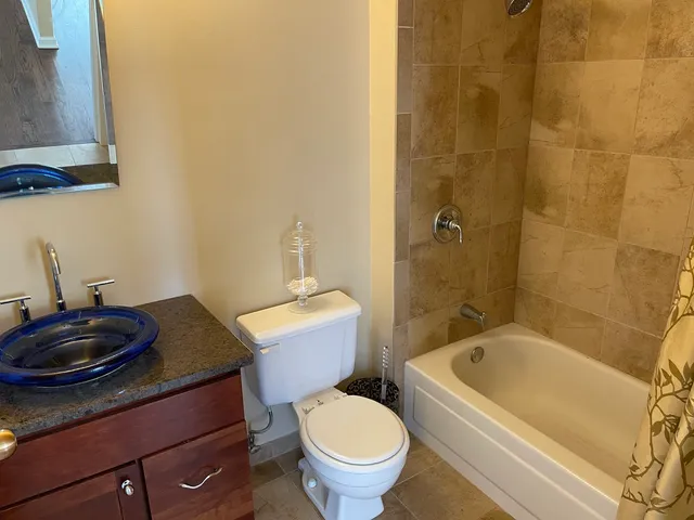 a bathroom with a sink a toilet and a bathtub