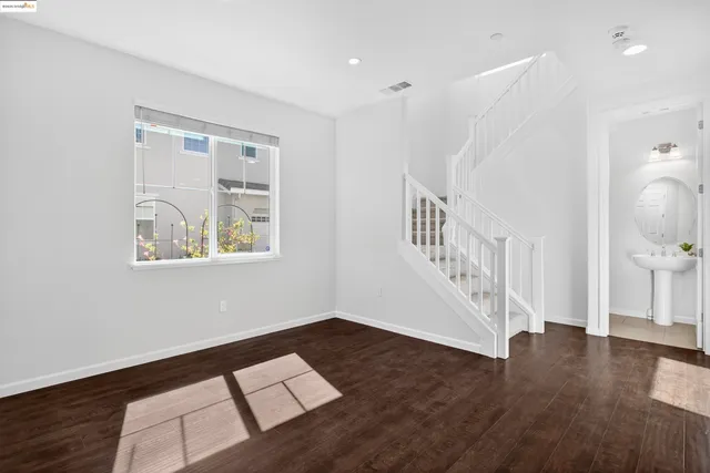 a view of an entryway with wooden floor