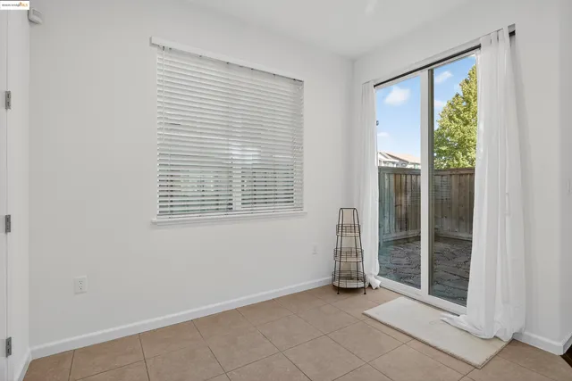 a view of an empty room with glass door