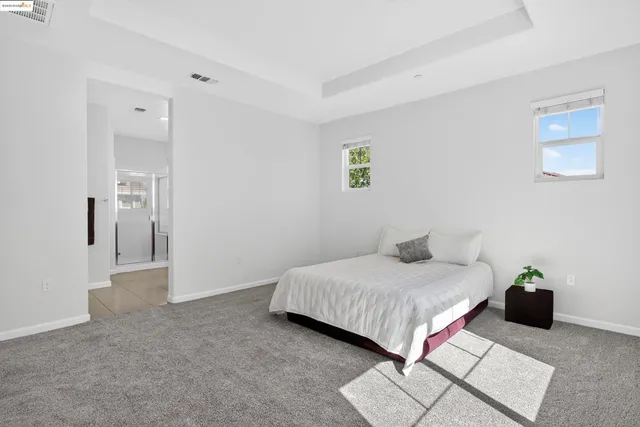 a bedroom with a bed and a table