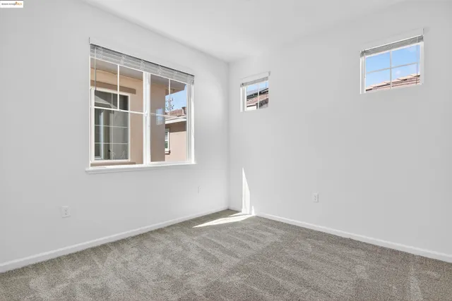 a view of empty room with windows