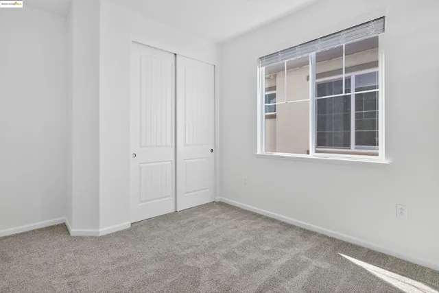 a view of empty room with windows