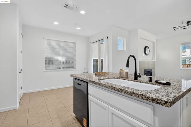 a kitchen with a sink and a window