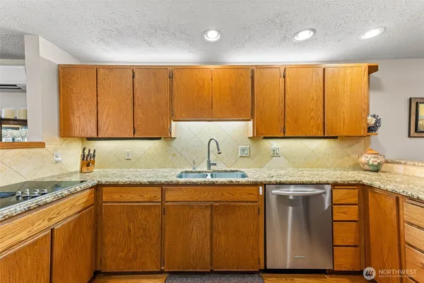 a kitchen with a sink a cabinets and window