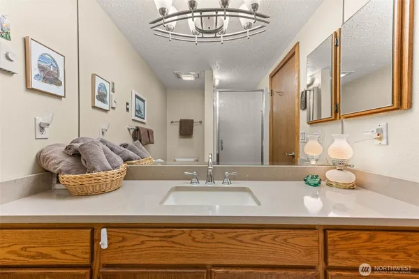 a living room with a bed furniture and a large window