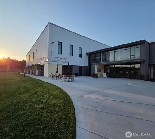 a view of a building with a fountain in a patio