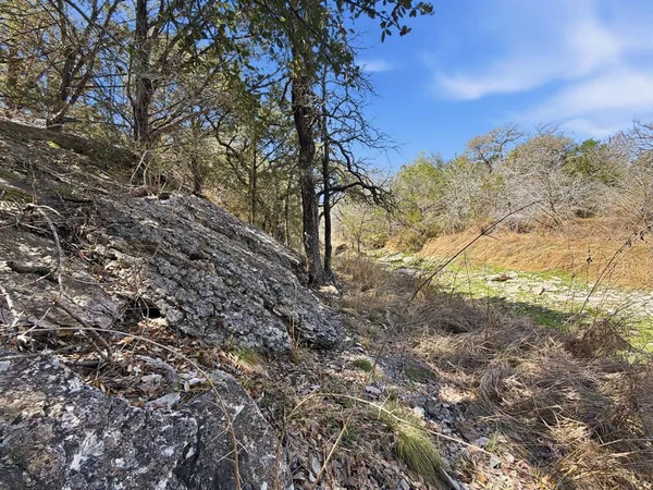 a view of lake with sunset