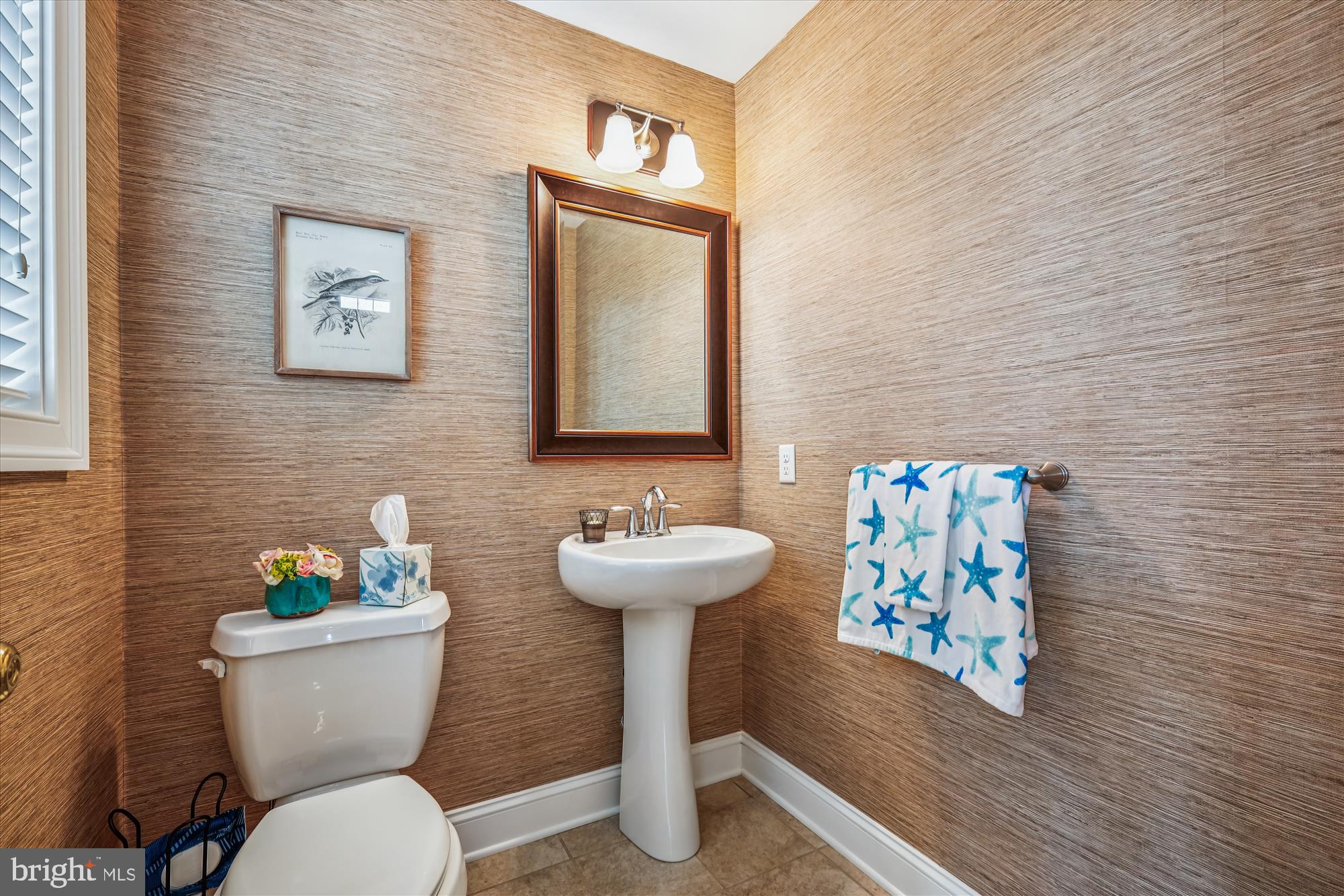 635 Dominion Road Chester, MD 21619 - Photo 19 of 50 a bathroom with a toilet a sink and a mirror