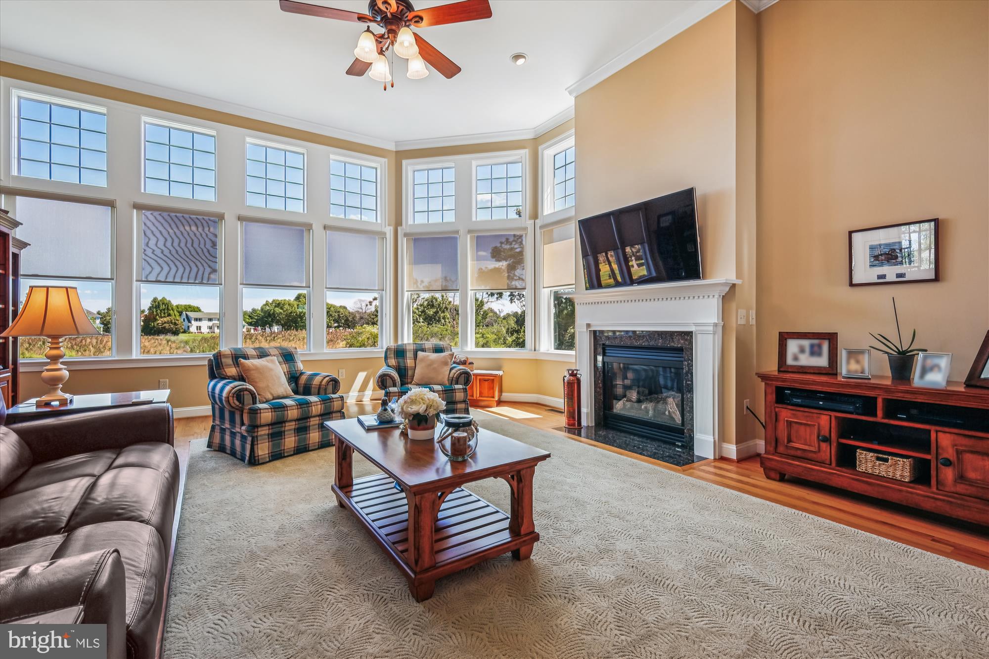 635 Dominion Road Chester, MD 21619 - Photo 21 of 50 a living room with furniture fireplace and a large window