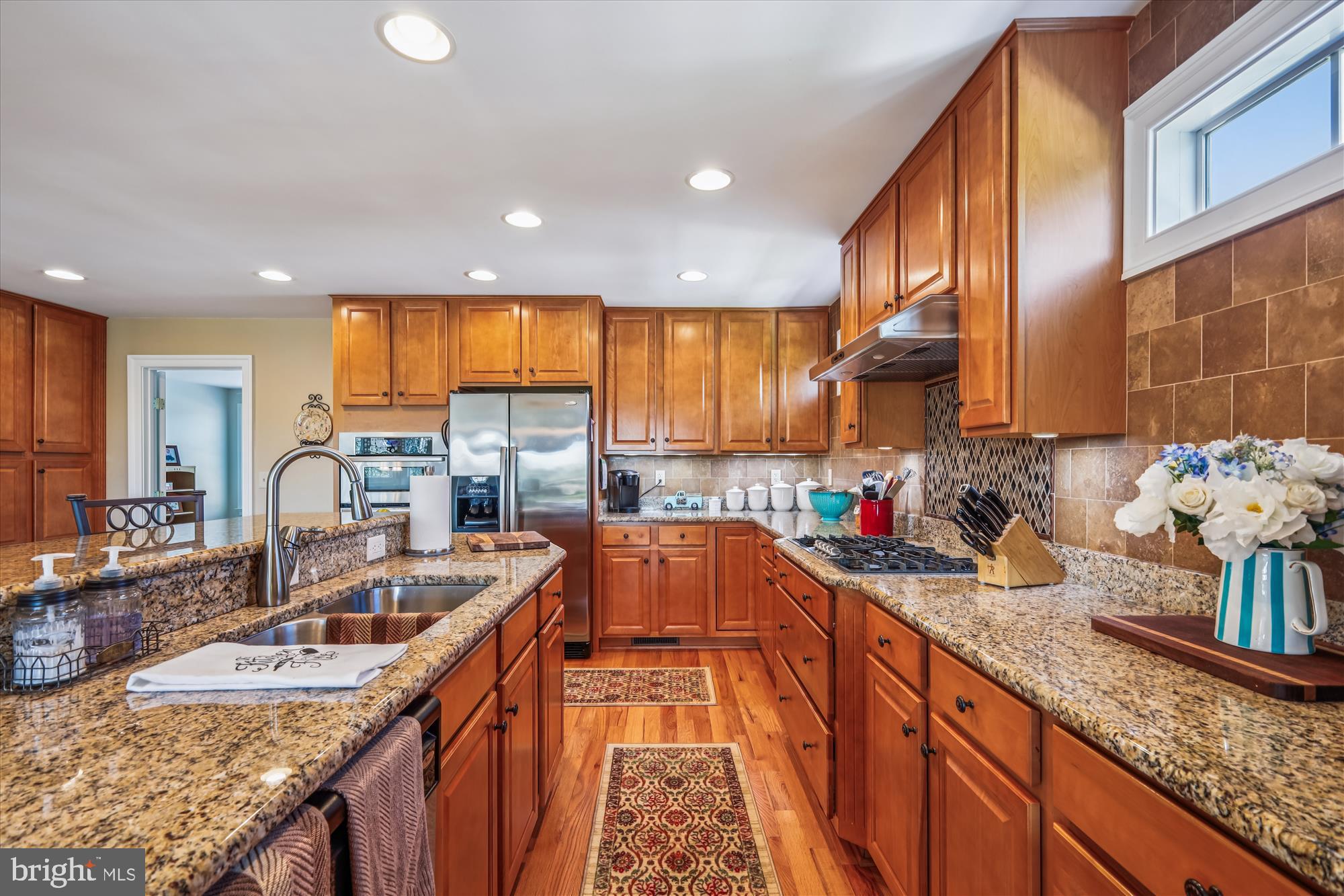 635 Dominion Road Chester, MD 21619 - Photo 25 of 50 a kitchen with stainless steel appliances granite countertop a sink stove and cabinets