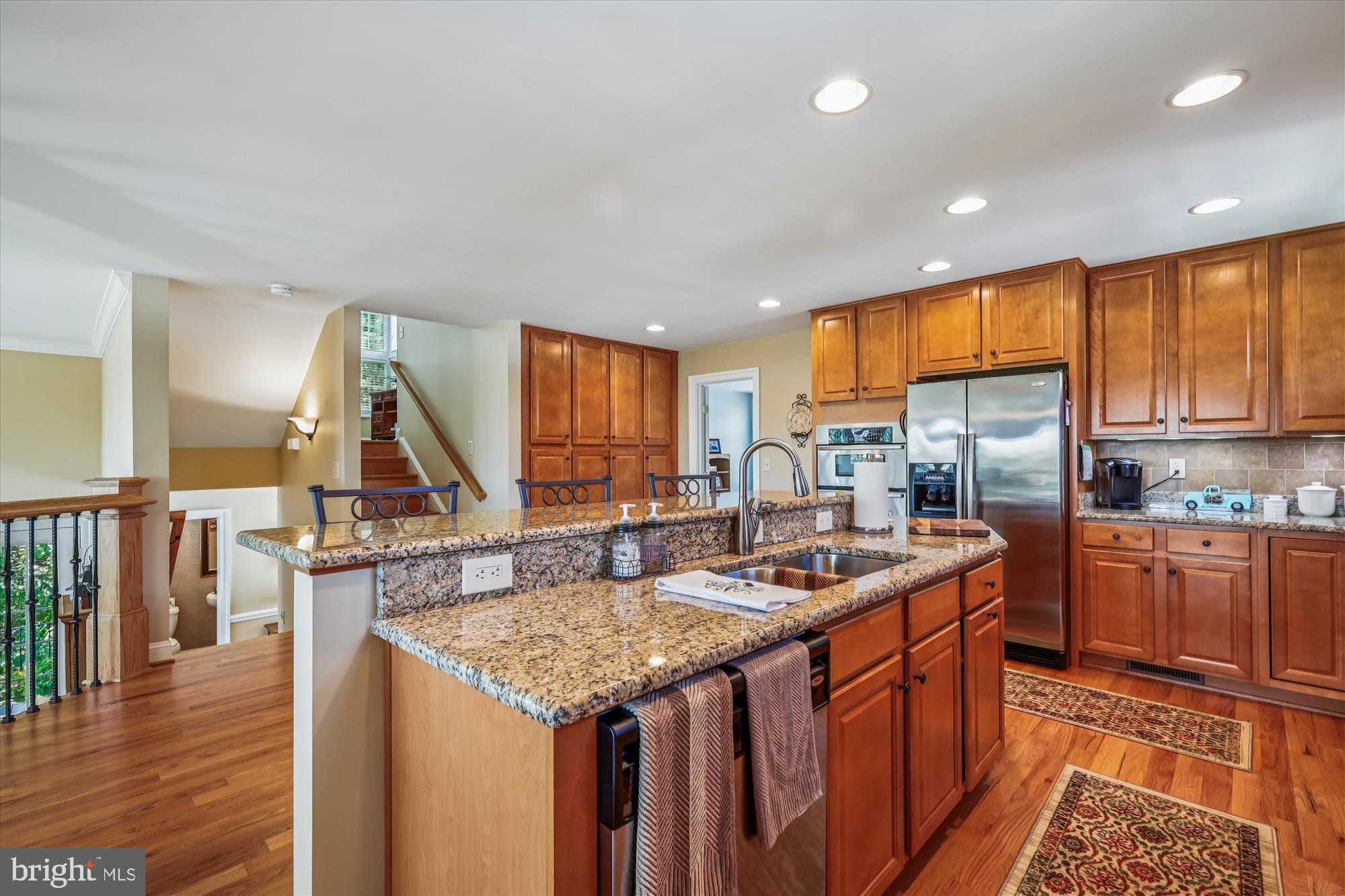 635 Dominion Road Chester, MD 21619 - Photo 26 of 50 a kitchen with stainless steel appliances granite countertop a sink stove and refrigerator