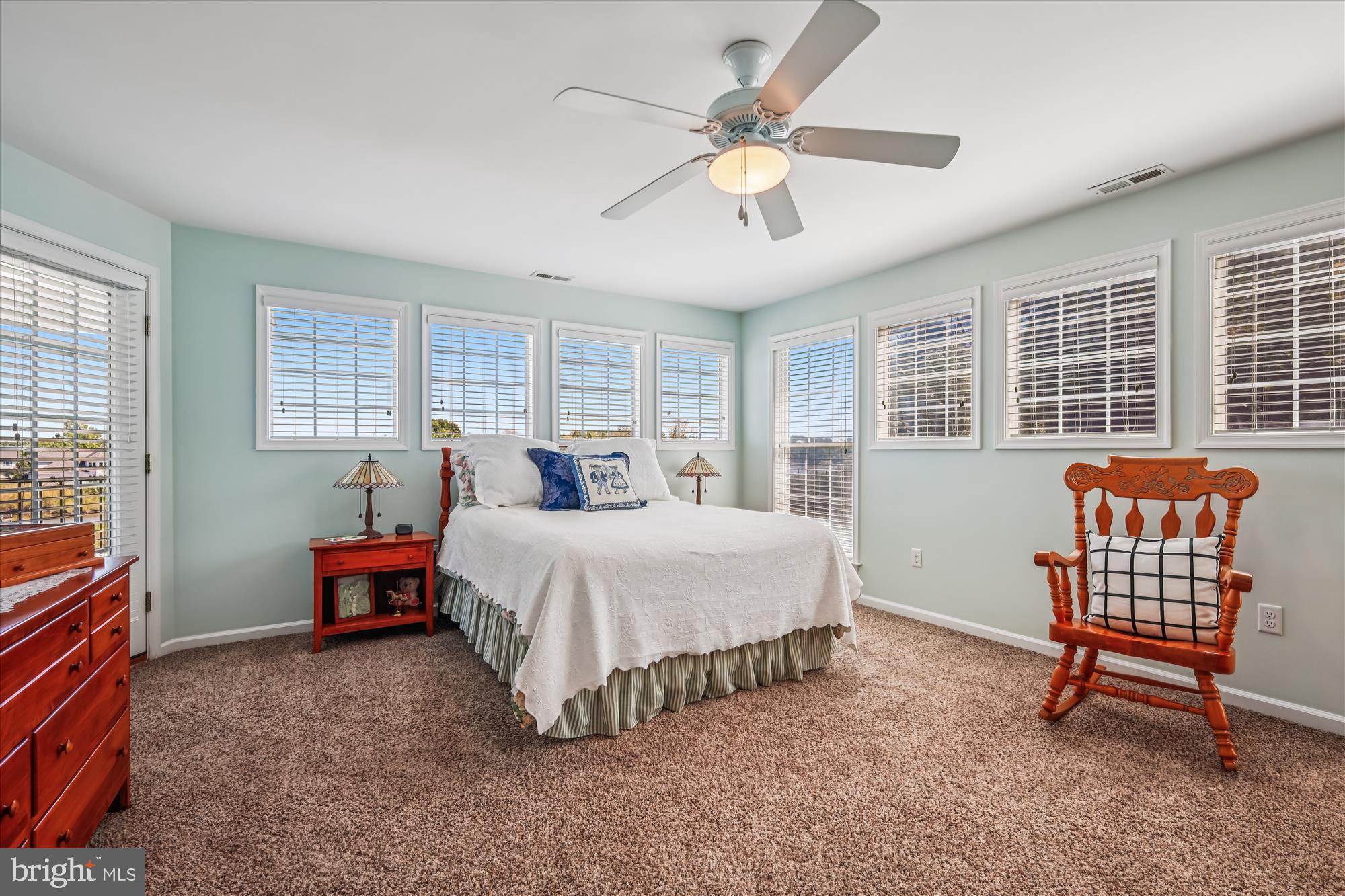 635 Dominion Road Chester, MD 21619 - Photo 36 of 50 a spacious bedroom with a bed and a chandelier