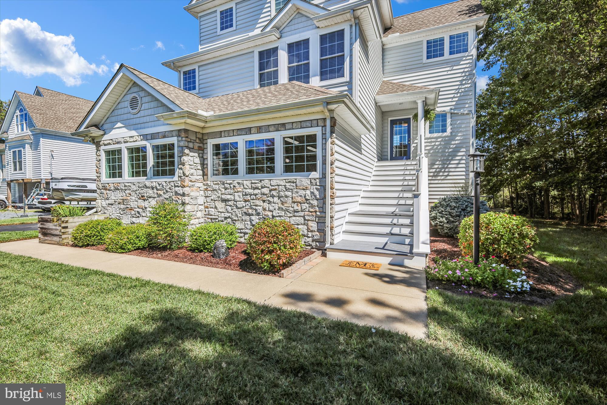 635 Dominion Road Chester, MD 21619 - Photo 4 of 50 a front view of a house with a garden and plants