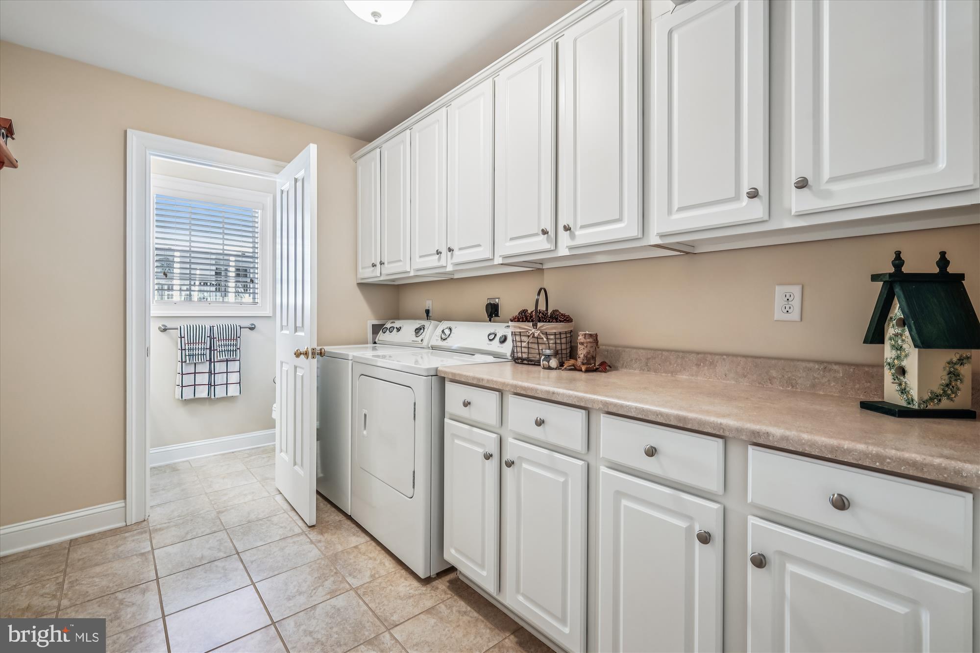 635 Dominion Road Chester, MD 21619 - Photo 41 of 50 a kitchen with granite countertop white cabinets and sink