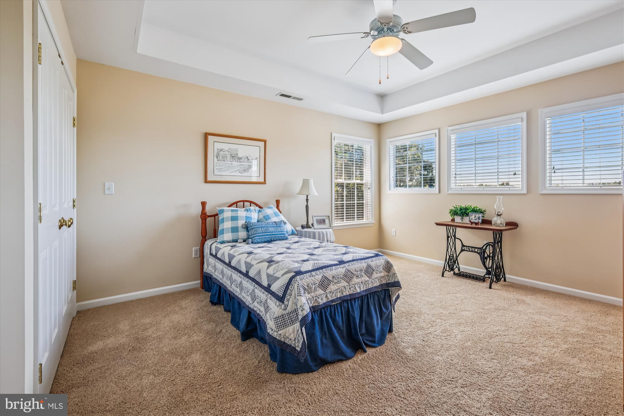 635 Dominion Road Chester, MD 21619 - Photo 43 of 50 a spacious bedroom with a bed and a table in it
