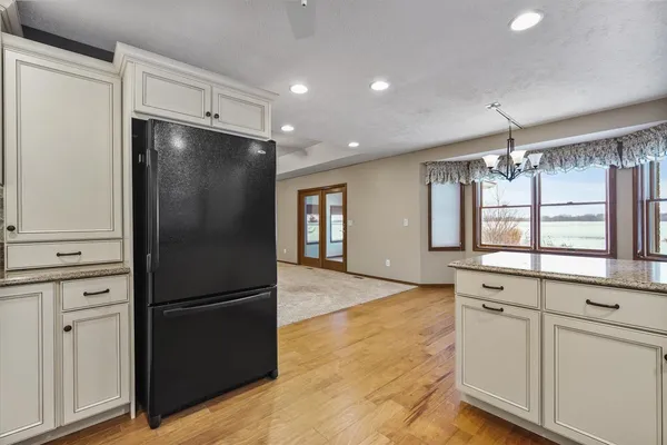 a kitchen with a refrigerator and a refrigerator