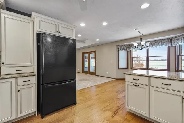 a kitchen with a refrigerator and a refrigerator