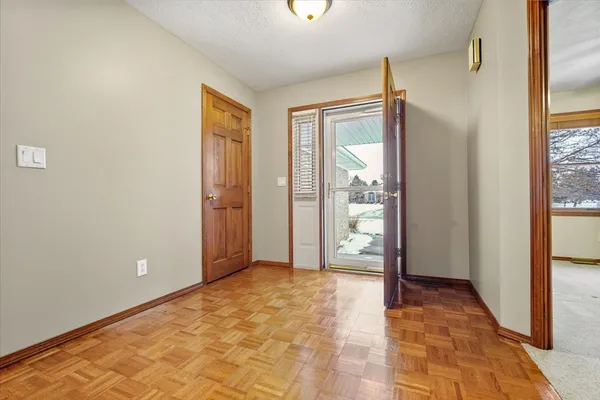 a view of entryway with wooden floor