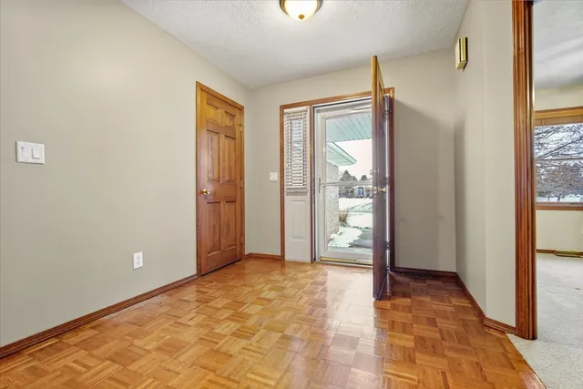 a view of entryway with wooden floor