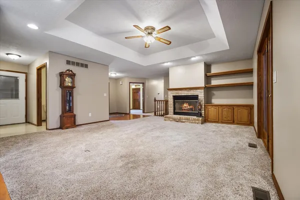 a view of an empty room with a fireplace