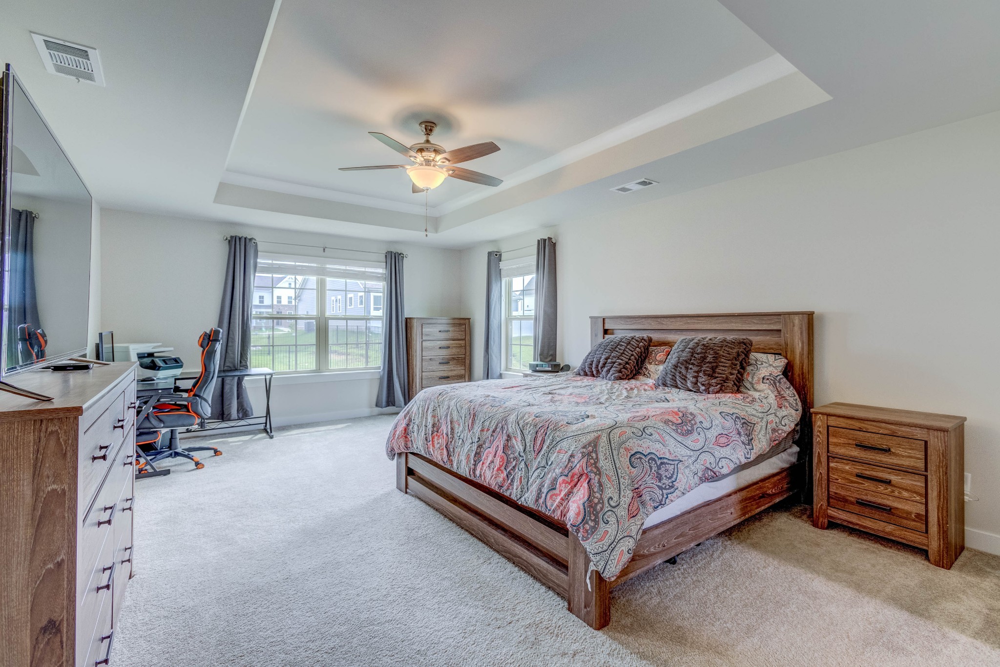 315 Collier Road Mount Juliet, TN 37122 - Photo 15 of 34 a bedroom with a bed a chandelier and a chair