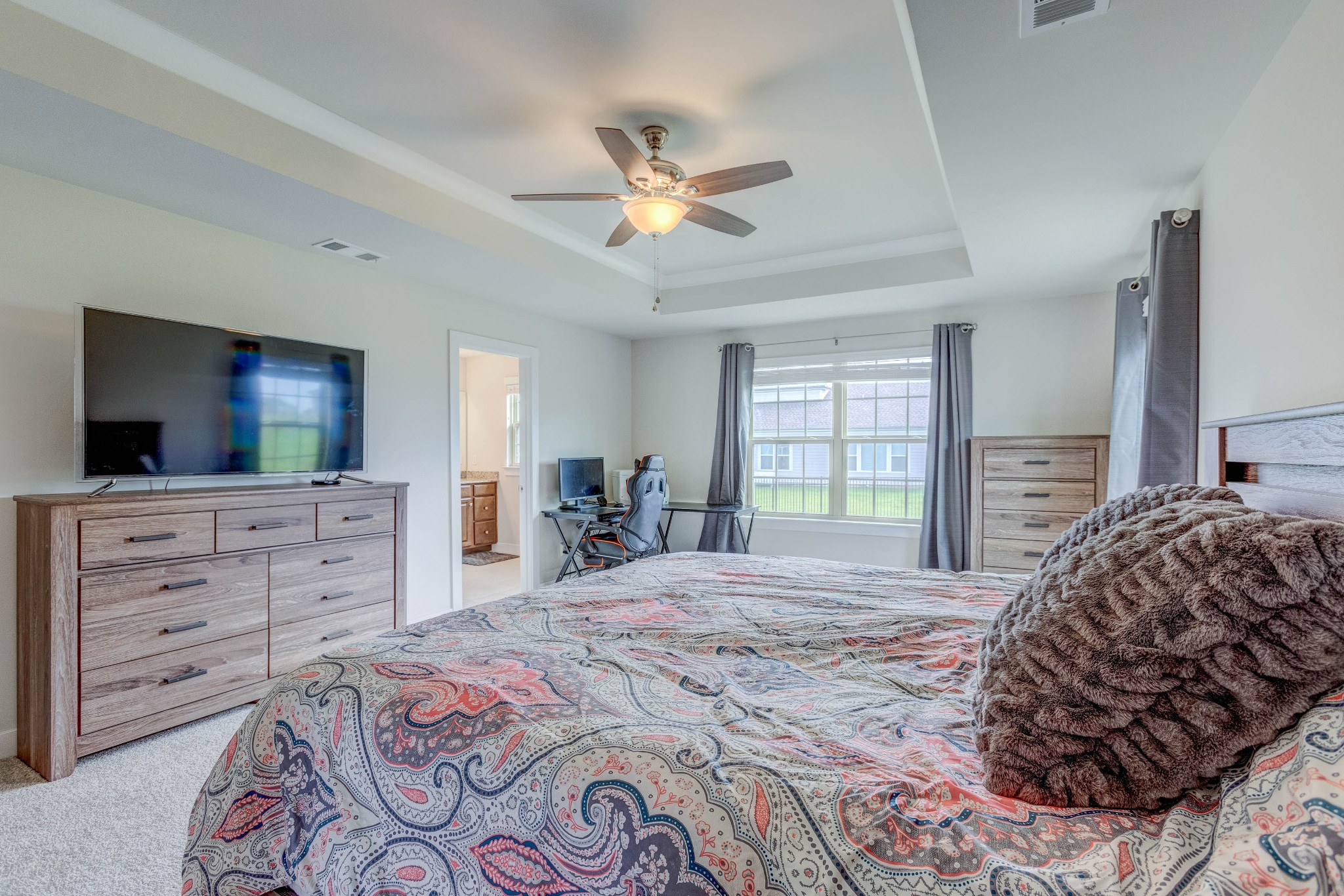 315 Collier Road Mount Juliet, TN 37122 - Photo 16 of 34 a bedroom with a bed and a flat screen tv