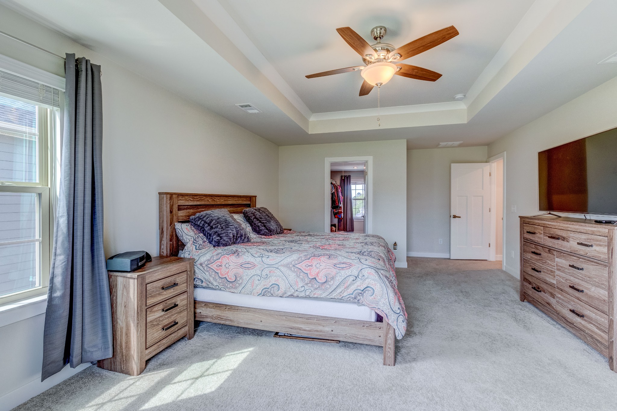 315 Collier Road Mount Juliet, TN 37122 - Photo 17 of 34 a spacious bedroom with a bed and a flat screen tv
