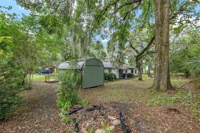a backyard of a house with lots of green space