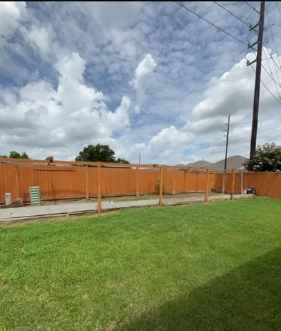 a view of a lake with houses in the background