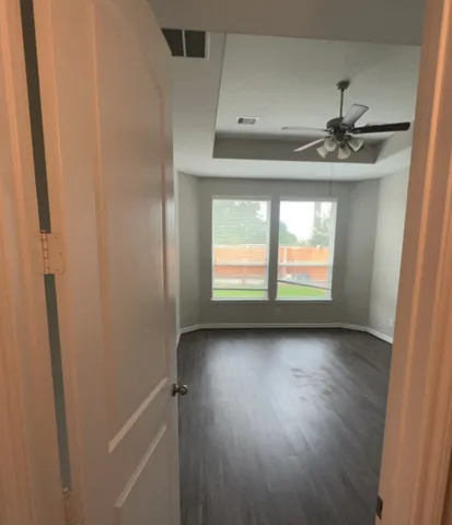 a view of an empty room with a window