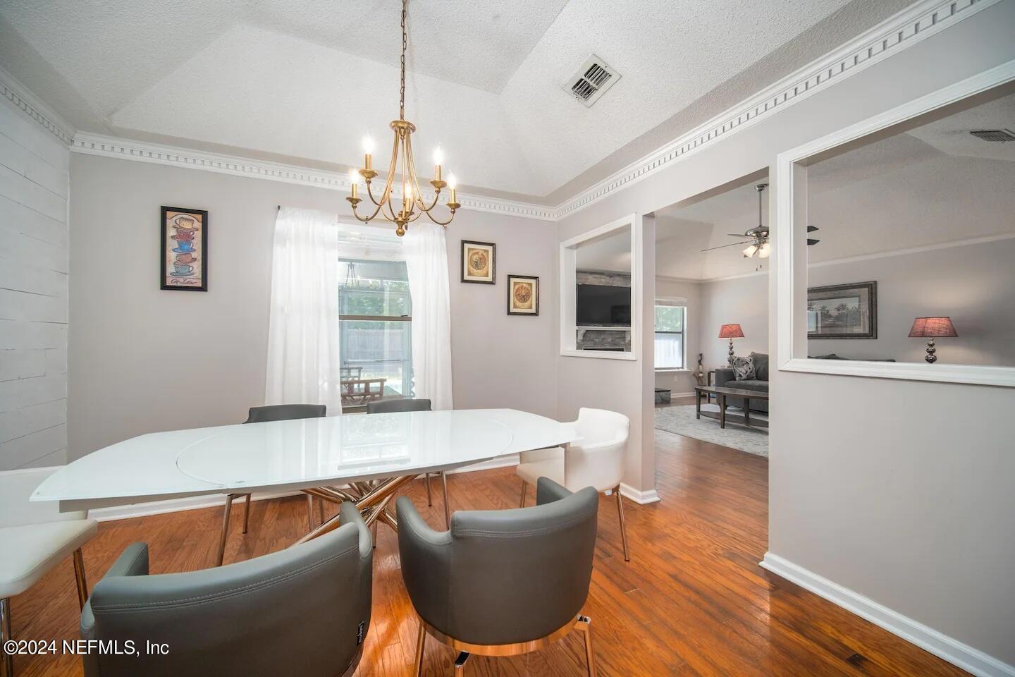 10062 Hawks Hollow Road Jacksonville, FL 32257 - Photo 11 of 39 a room with wooden floor and furniture