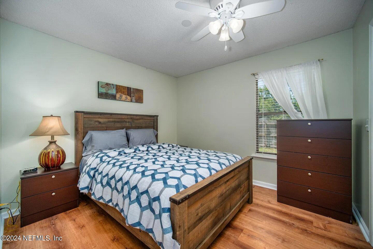 10062 Hawks Hollow Road Jacksonville, FL 32257 - Photo 18 of 39 a bedroom with a bed and window