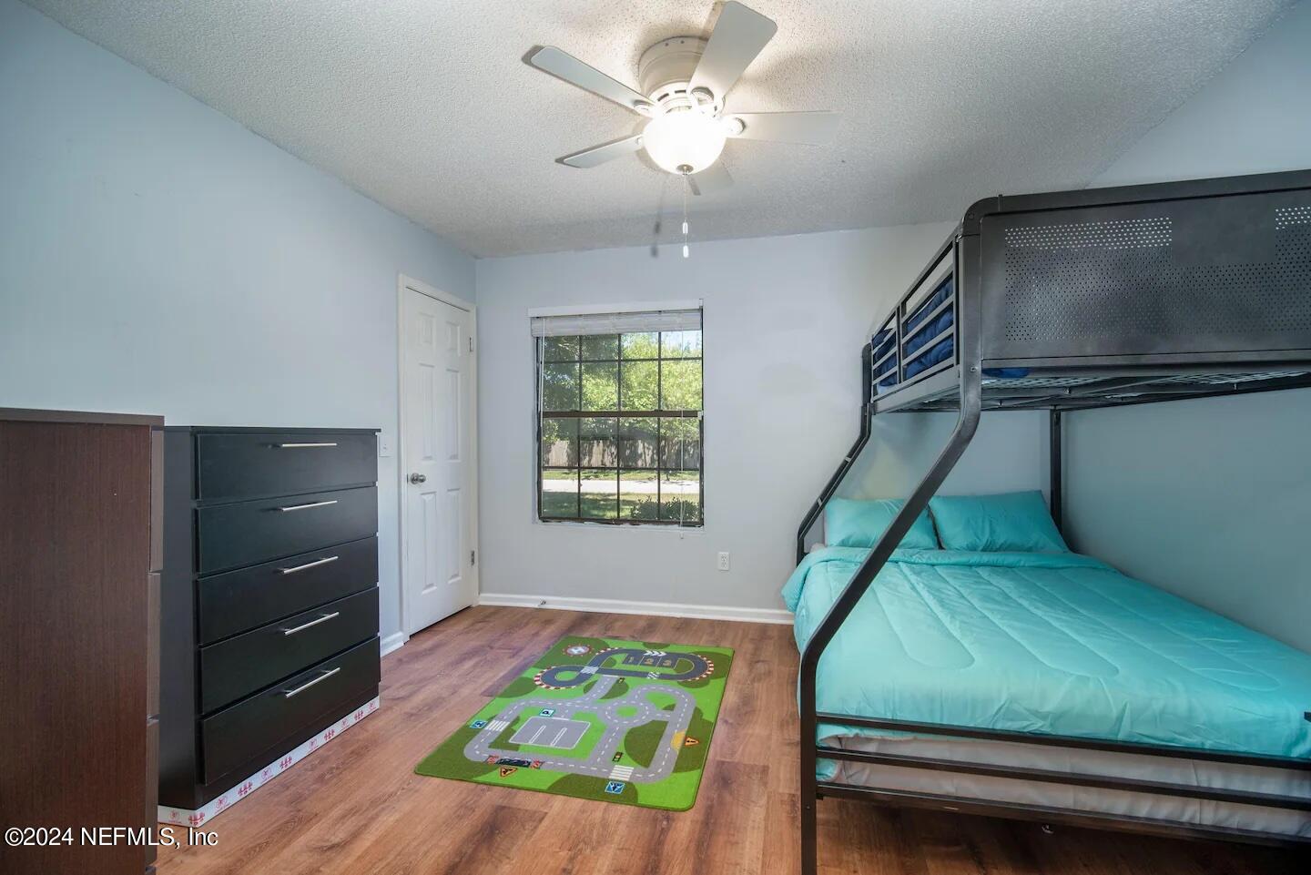 10062 Hawks Hollow Road Jacksonville, FL 32257 - Photo 23 of 39 a bedroom with a bed and a dresser